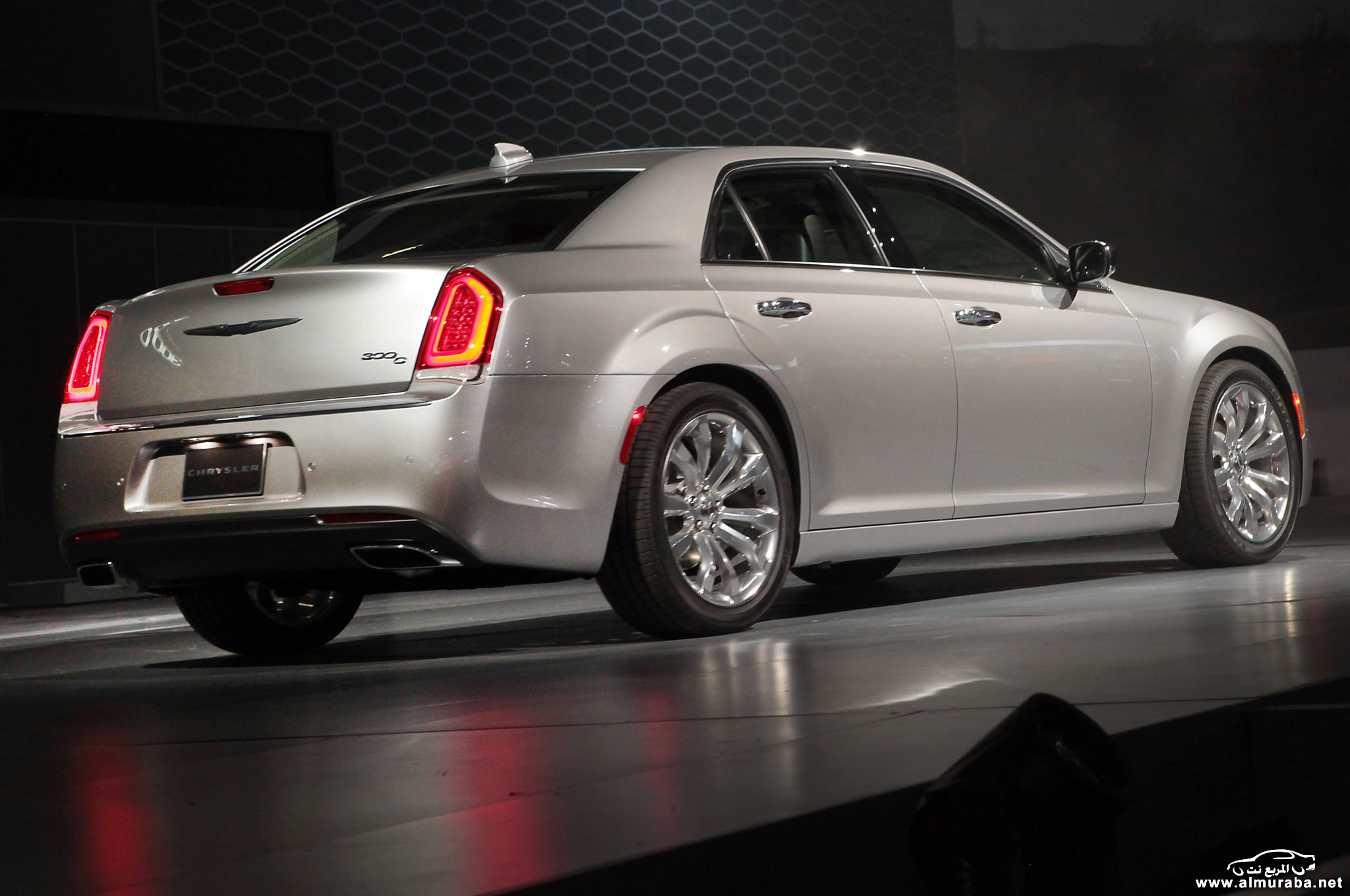 2015-chrysler-300-on-stage-rear-side-view