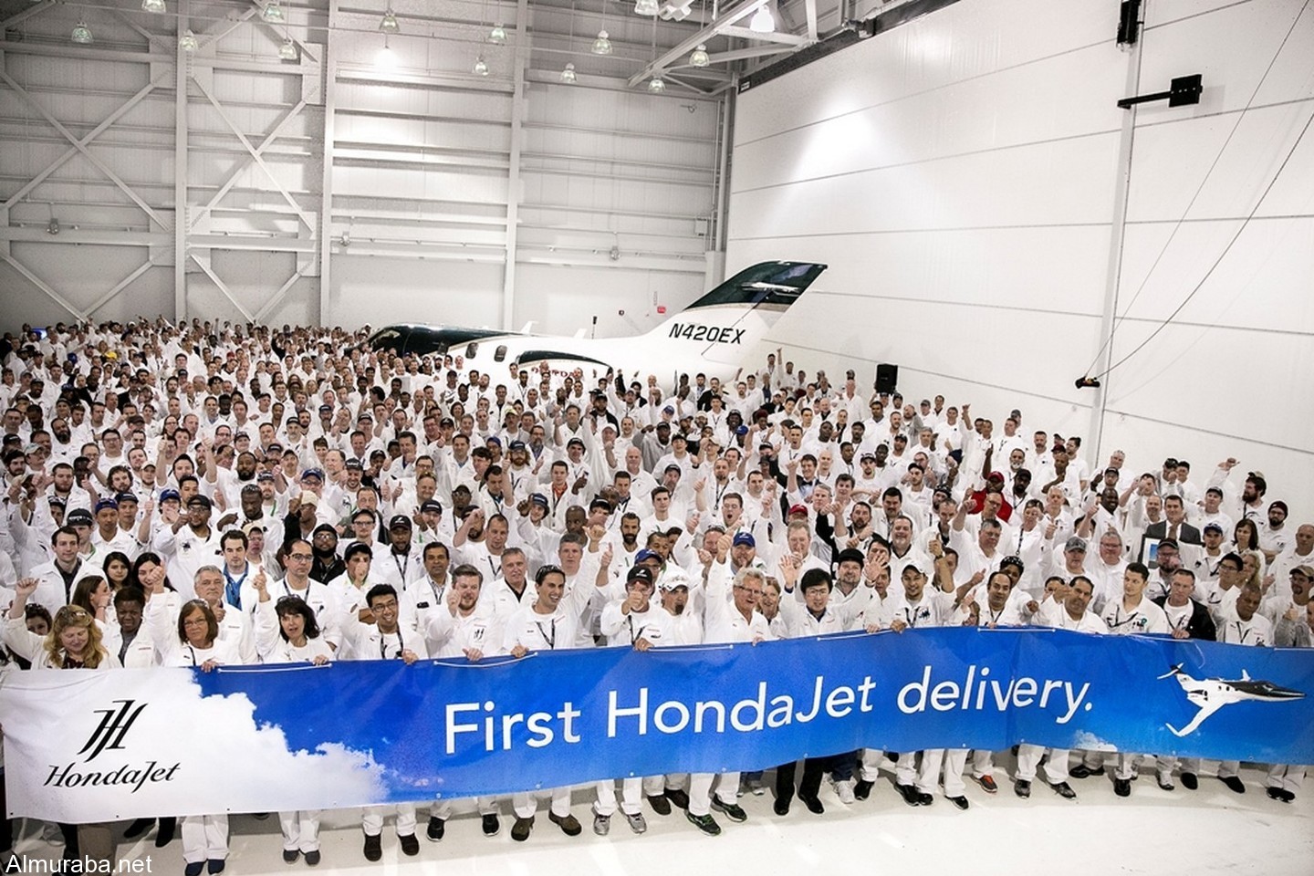 Honda Aircraft Company associates celebrate the first HondaJet delivery.