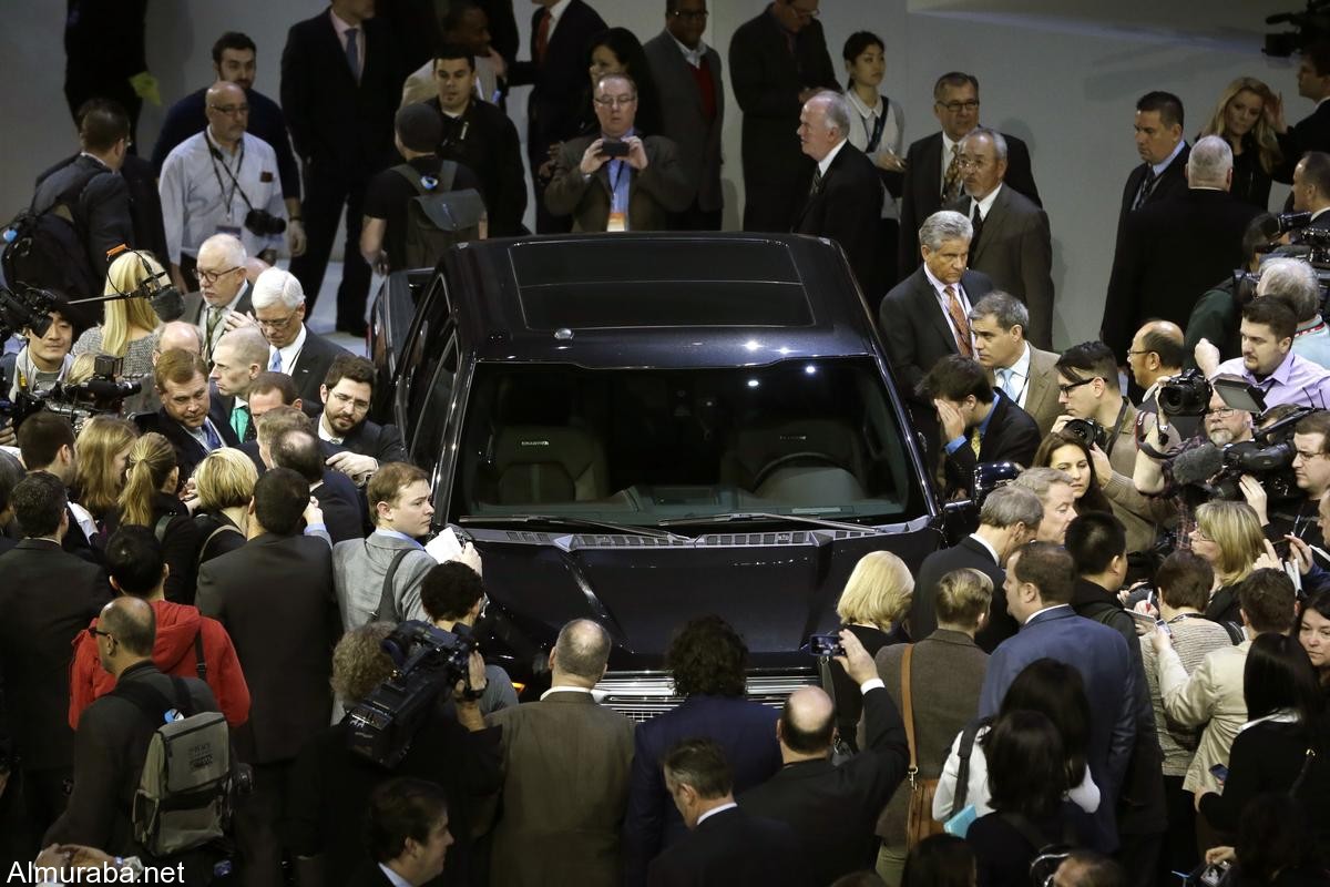 Journalists surround the new F-150 with a body built almost entirely out of aluminum at the North American International Auto Show in Detroit, Monday, Jan. 13, 2014. (AP Photo/Carlos Osorio)