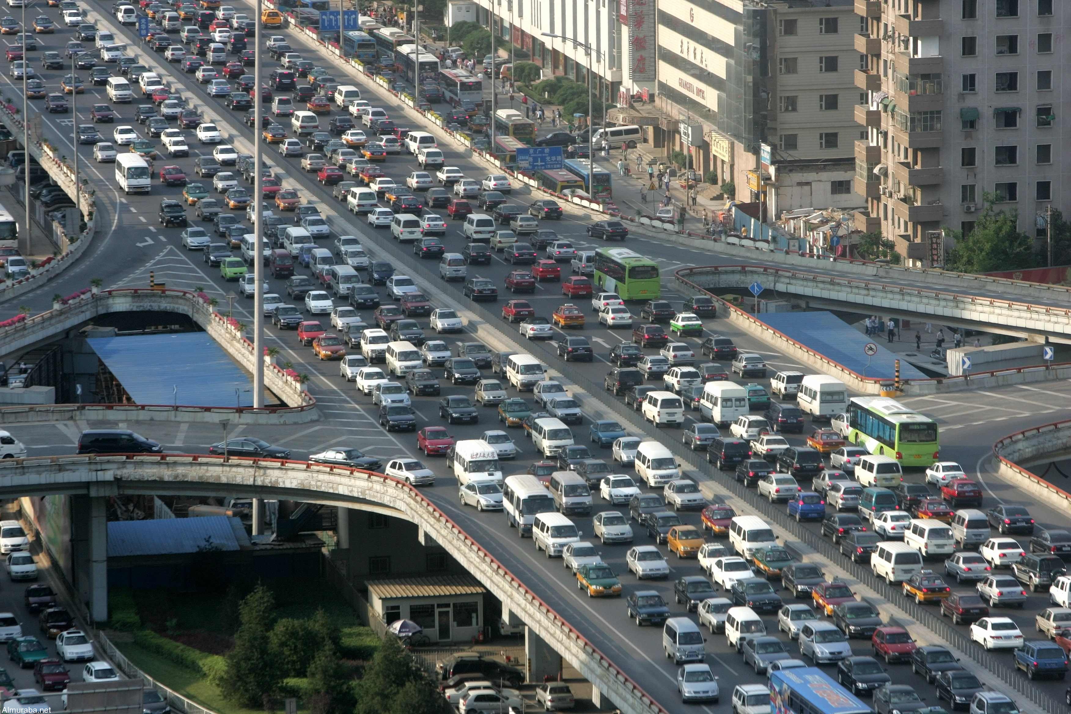 A traffic jam is seen during the rush hour in Beijing June 14, 2006. China needs to improve public transport to help curb choking traffic jams instead of building more and more highways to make room for private cars, the World Bank said on Wednesday.  REUTERS/ Jason Lee (CHINA)