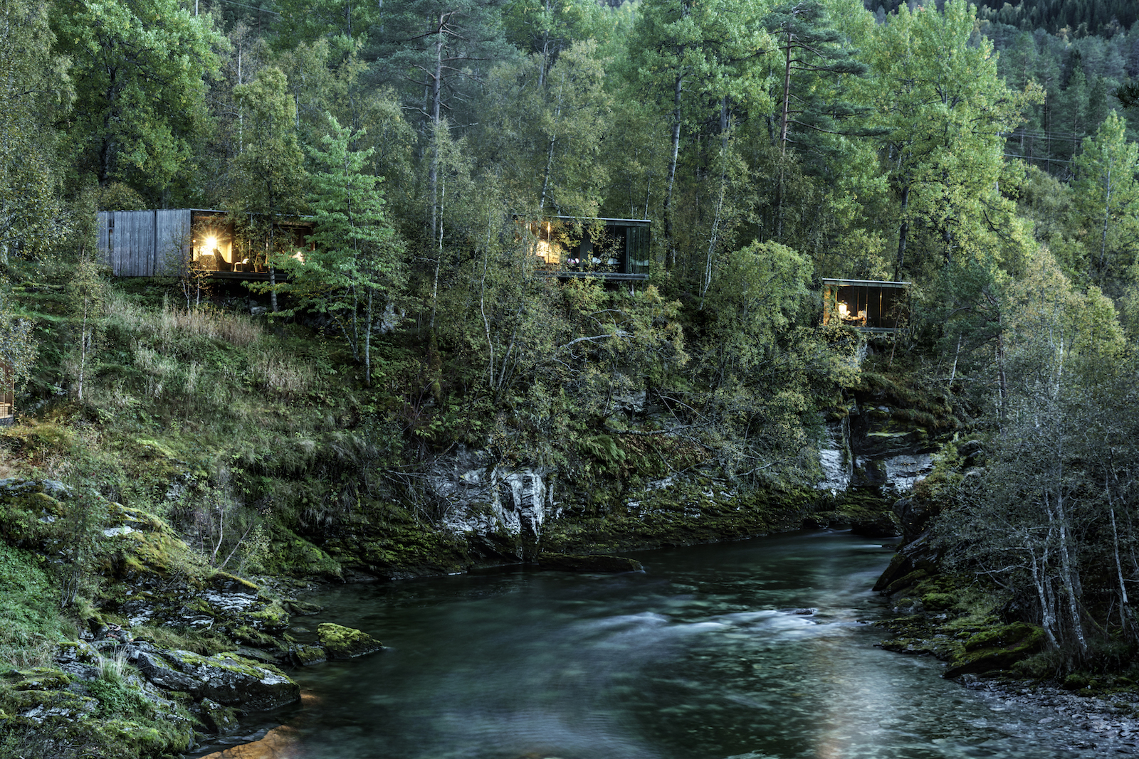 NORWAY. 2016. Valldal. Juvet Landscape Hotel in Valldal. The hotel consists of series of freestanding wood and glass structures, each set with a close view of the woods and river gorge. The hotel is designed by Jensen & Skodvin architects.